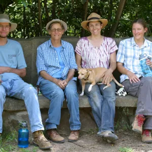 Charlie Adams, Katie Adams, Betsy Lape and Ginger, and Emily Adams at the Studebaker Bench