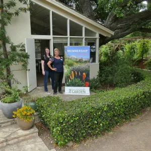 Rita Boss and Stacy Bloodworth with a new membership display banner
