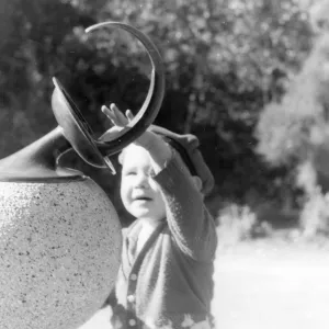Child touching SBBG Sundial