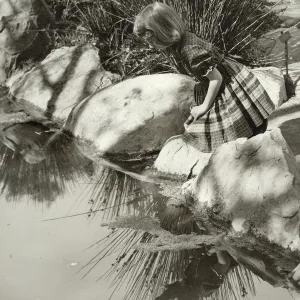 girl gazing into Pond