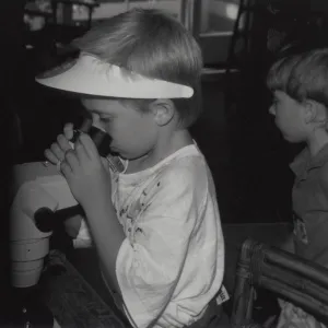 child with microscope