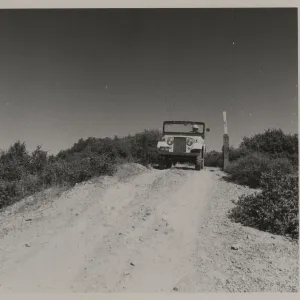Clif Smith in jeep, Sierra Madre Road, soon after construction