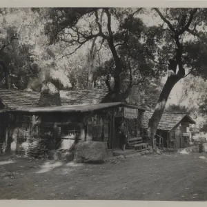 Woman Standing Outside Front Door of Cold Spring Tavern