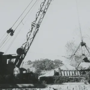 North Wing construction, crane moving boulders