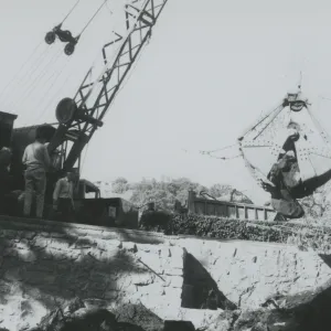 North Wing construction, crane moving boulders