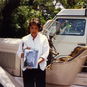 Sydney Baumgartner with picture of Elizabeth de Forest, car is Lockwood de Forest's â€˜Buffalo'
