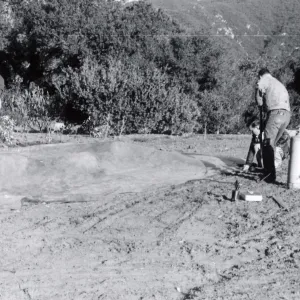 Miscellaneous Ground Work, members of the grounds crew spread a plastic tarp and weight down its edges preparatory to releasing Methyl Bromide gas beneath it, Fall, 1954