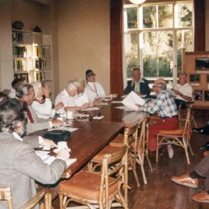 Board Members: Man at head of table (facing camera): Dr. William Stewart. Man on right side of table w/orange slacks & glasses: Campbell Grant