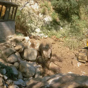 bulldozer repair to bank of Mission Creek below the Guild House