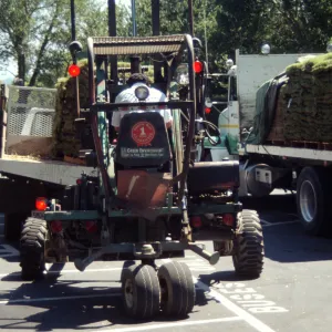 tractor unloading sod for Meadow lawn