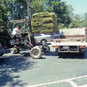 tractor unloading sod for the new Meadow lawn Installation