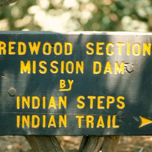 wood directional sign 'Redwood Section, Mission Dam, Indian Steps, Indian Trail' Sign