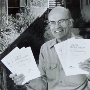 Dara Emery with copies of 'Seed Propagation of Native California Plants'