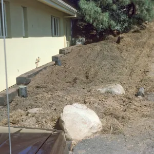 Construction: wall complete E. side of can yd before wall added