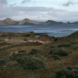 West San Benito Island, village & view of East San Benito Island