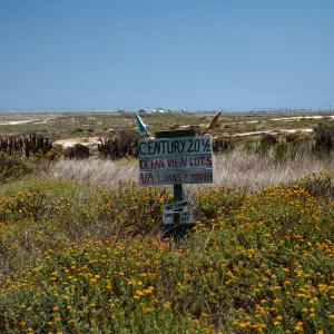 real estate sign in front of fire station by compound, San Nicolas Island