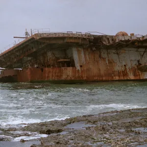 14/ rear end of aircvraft carrier aground on reef, 65-179 & SN-94